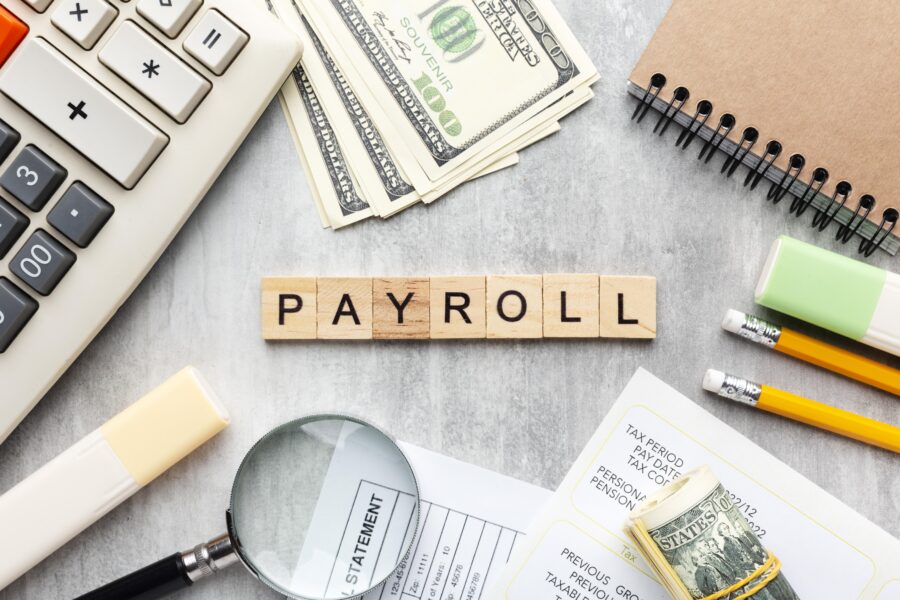 top view payroll concept with items